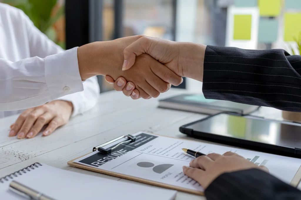 People shaking hands at Covert Recruiting
